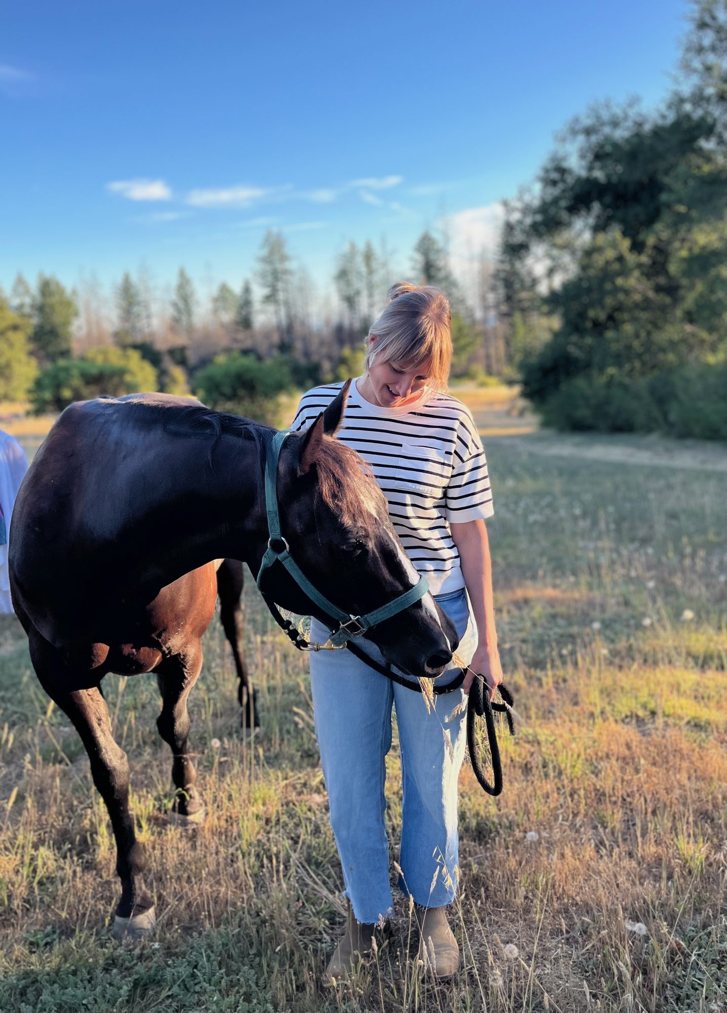 Ingrid LaRiviere walking with her horse